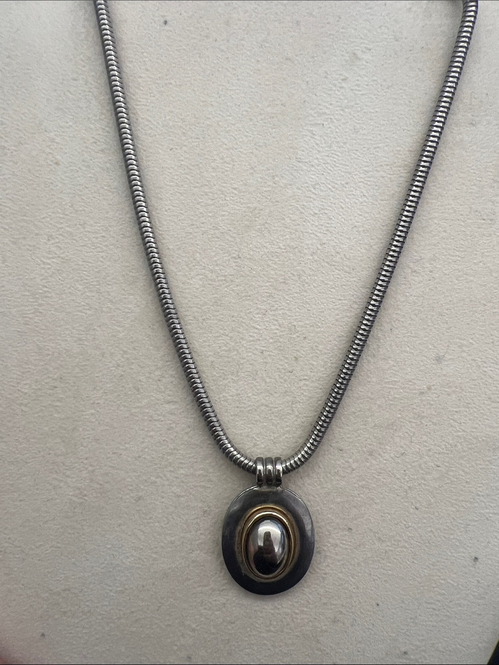 LCI Vintage necklace in silver tone. with round charm,  34”